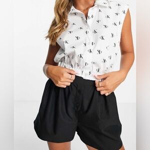 Calvin Klein Jeans sleeveless cropped button front shirt in white